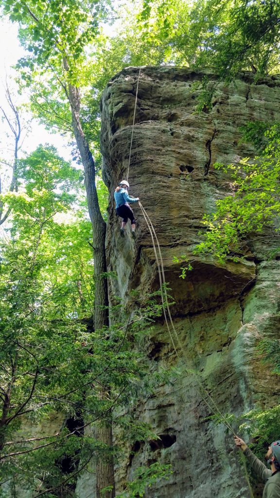 rappelling down a cliff in Hocking Hills, Ohio