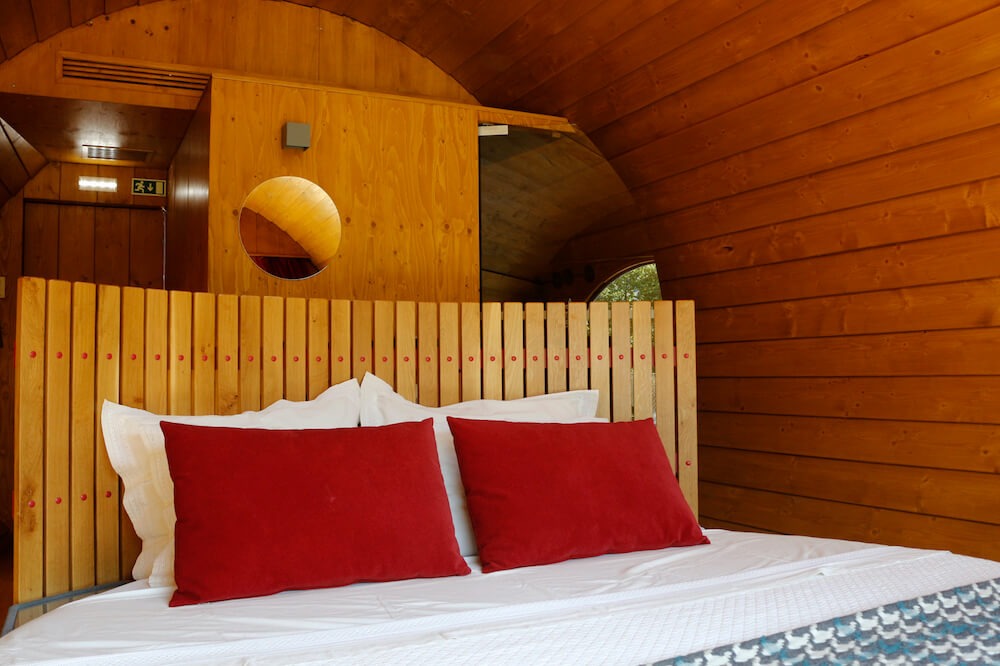 view of bed in Wine Barrel suite