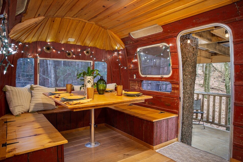kitchen table in airstream treehouse rental in Ohio