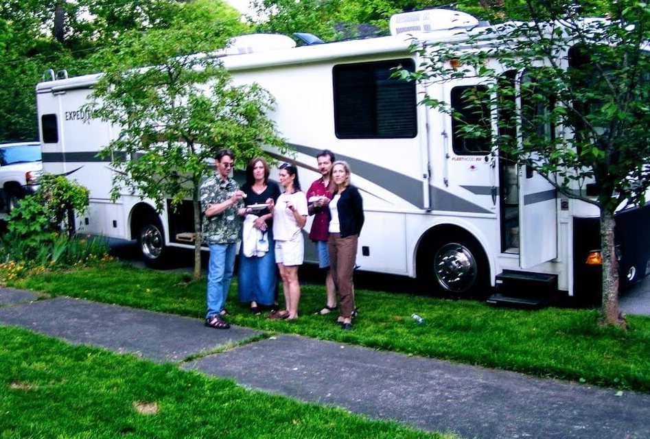 people in front of an RV