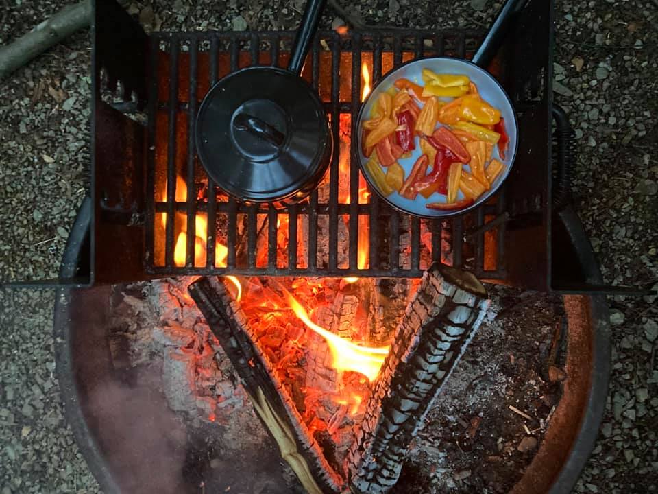 campfire with roasting peppers

