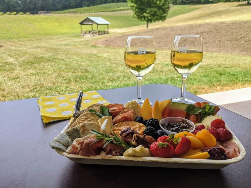 cheese tray glasses of wine at West Wind Winery Farm & Vineyard., one of the best things to do in Wytheville VA