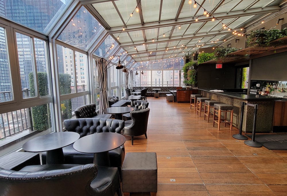 The penthouse level of The Kimberly is home to Upstairs, a glass-enclosed restaurant and bar with a retractable roof. By day it can serve up breakfast and brunch, and at night becomes a popular place for cocktails. (Photo courtesy of The Kimberly Hotel)