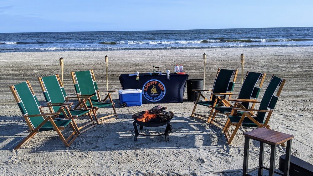 chairs and fire set up on a beach one of the best things to do in Cape San Blas