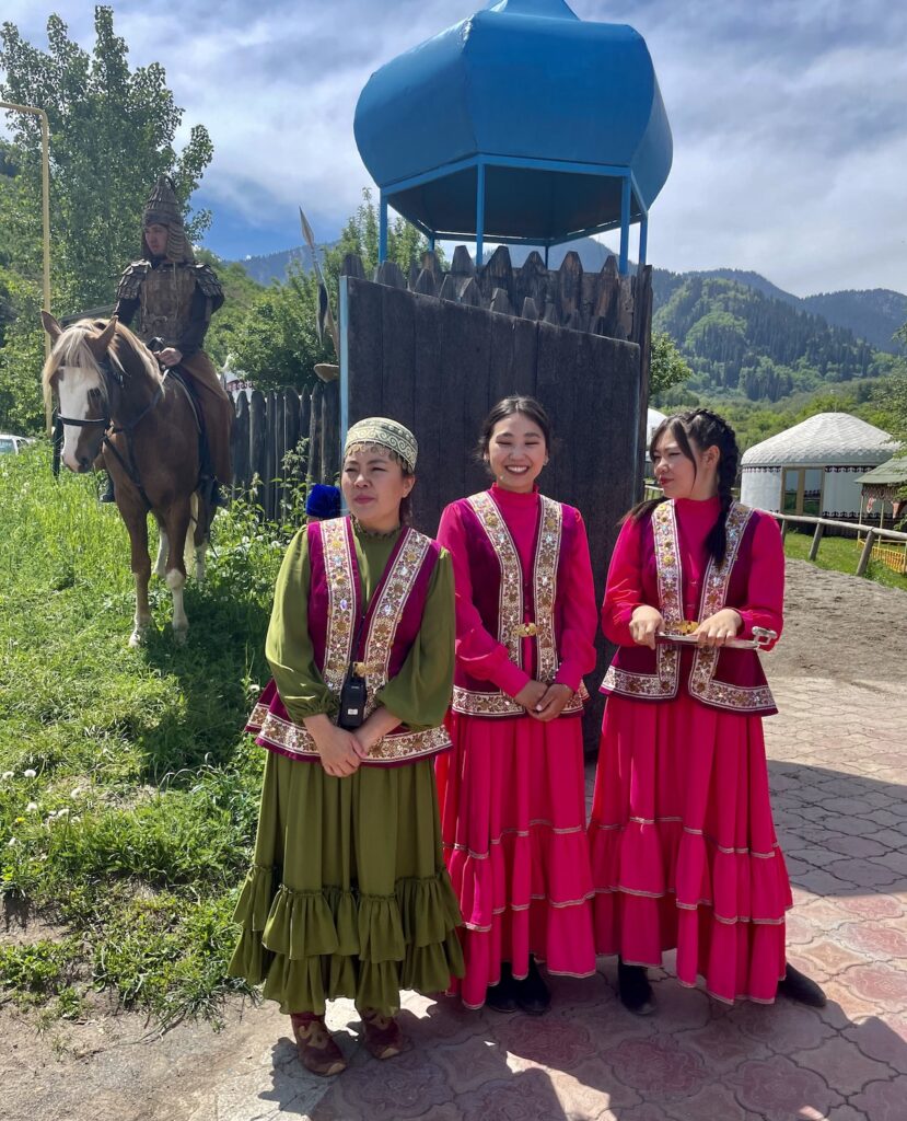 greeters in period costume at the ethno hun village, one of the day trips from Almaty