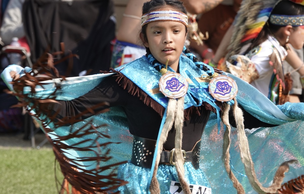 a young dancer at the powwow