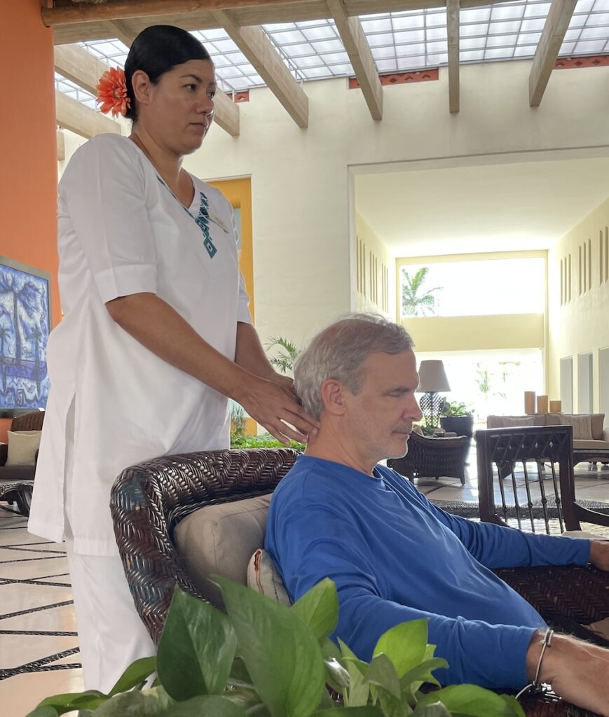 Chris Schroder getting back massage at Grand Velas