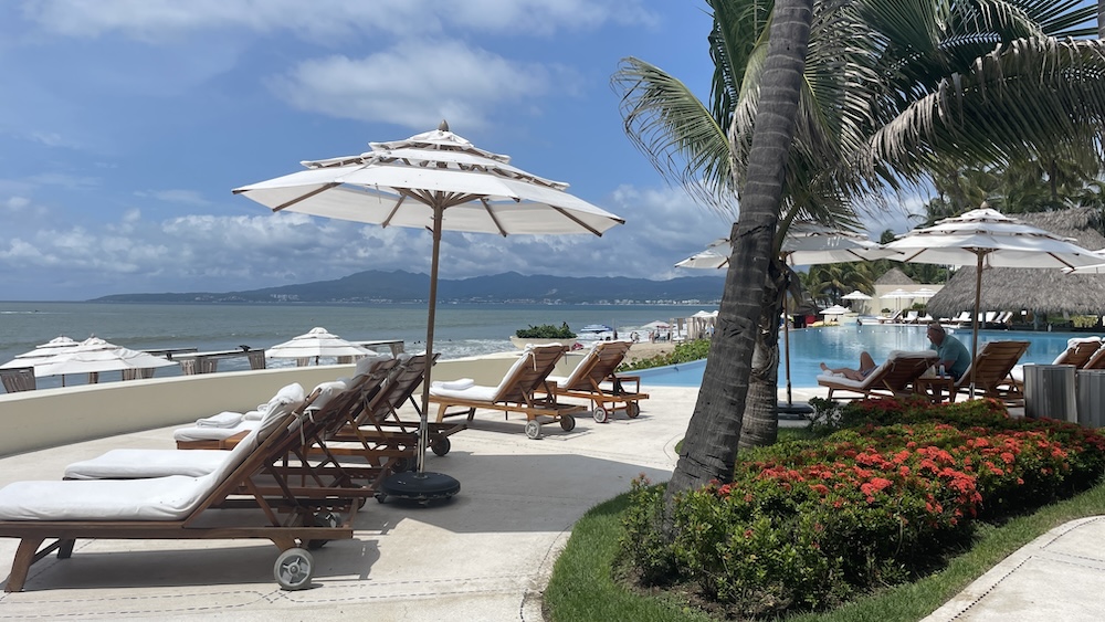 view of cabanas, pool and water at Grand Velas