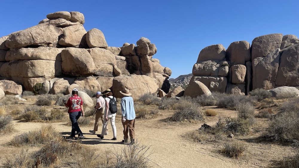 hikers with red jeep tours in joshua tree national park