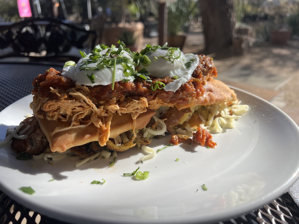 Dos Rancheros with red chile chicken on top at Tohono Chul Garden Bistro